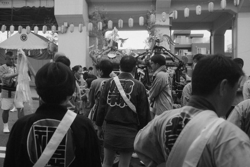 Black and white photo of people celebrating at a traditional Japanese festival