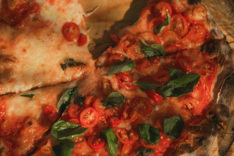 Wood-fired margherita pizza fresh from the oven