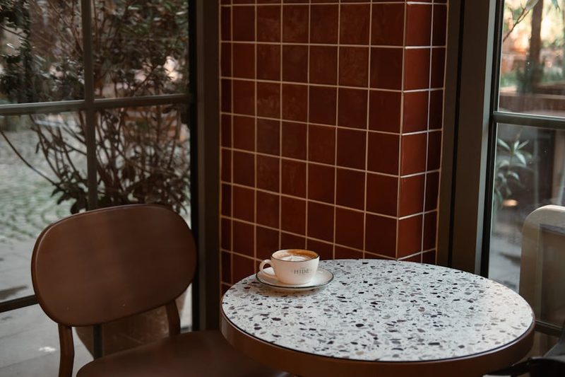 Inviting cafe corner with marble table and warm atmosphere