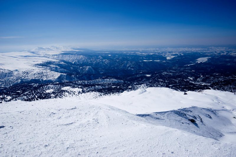 Snow-covered mountain landscape in Hokkaido, Japan during winter