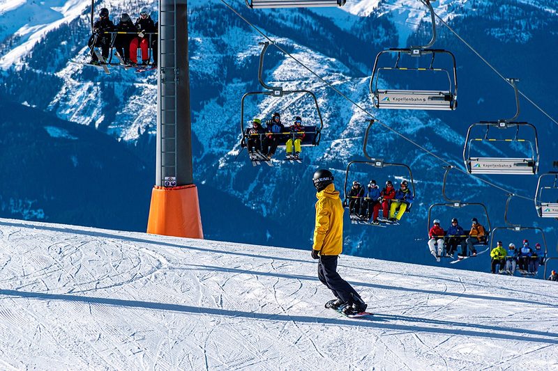 Panoramic view of a ski resort nestled in snowy mountains