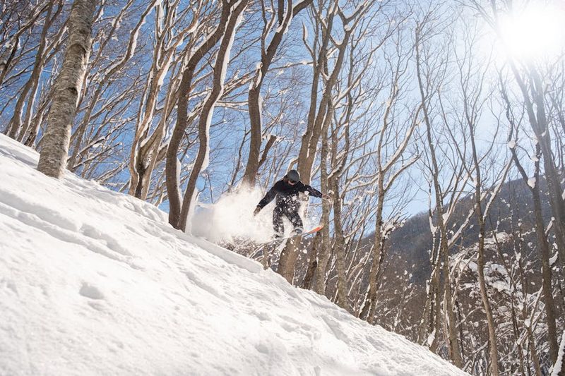 Snow-covered ski terrain with mountain views