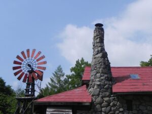 Iconic red windmill and stone chimney at Goro stone house, Kita no Kuni Kara filming location in Furano