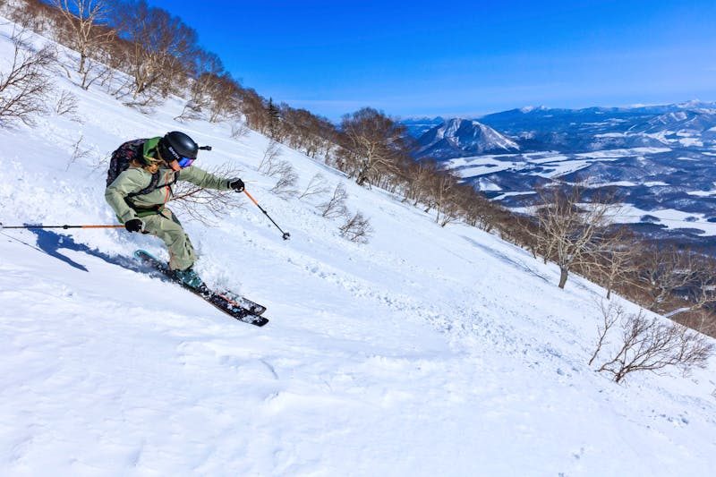 Quiet uncrowded ski slopes covered in fresh powder in Hokkaido