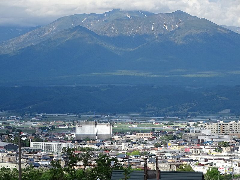 Panoramic view of Furano town with Tokachi mountain range in the background